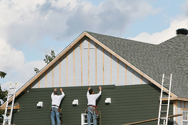 Professional Siding technician working in Cable, OH